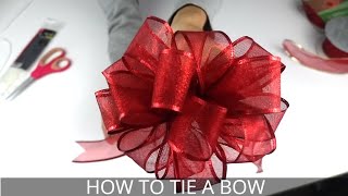 How to Make a Christmas Bow  Easiest BowMaking Method [upl. by Engapmahc]